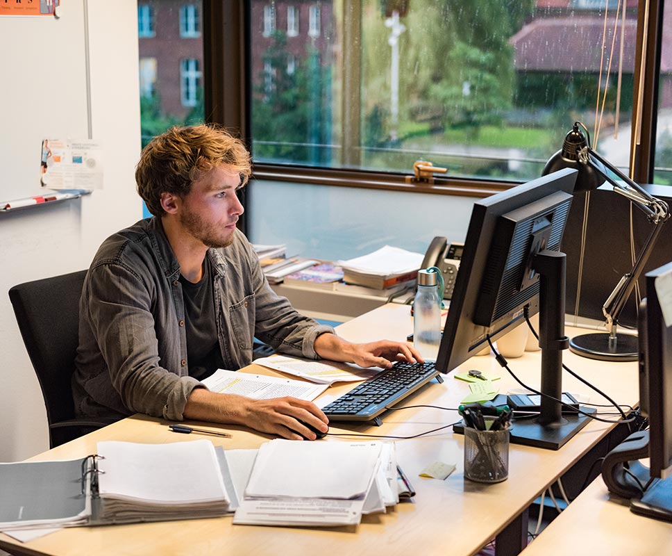 Young professor editing final dissertation